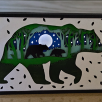 large bear and cub with lights